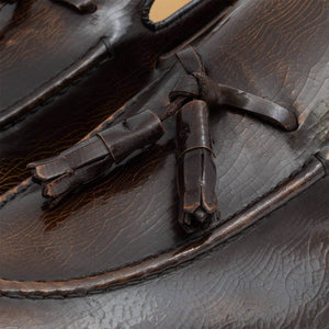 Mocassino artigianale Paulo in morbida pelle di vitello lucida marrone, con nappine e fondo cuoio. Collezione Il Gergo uomo.